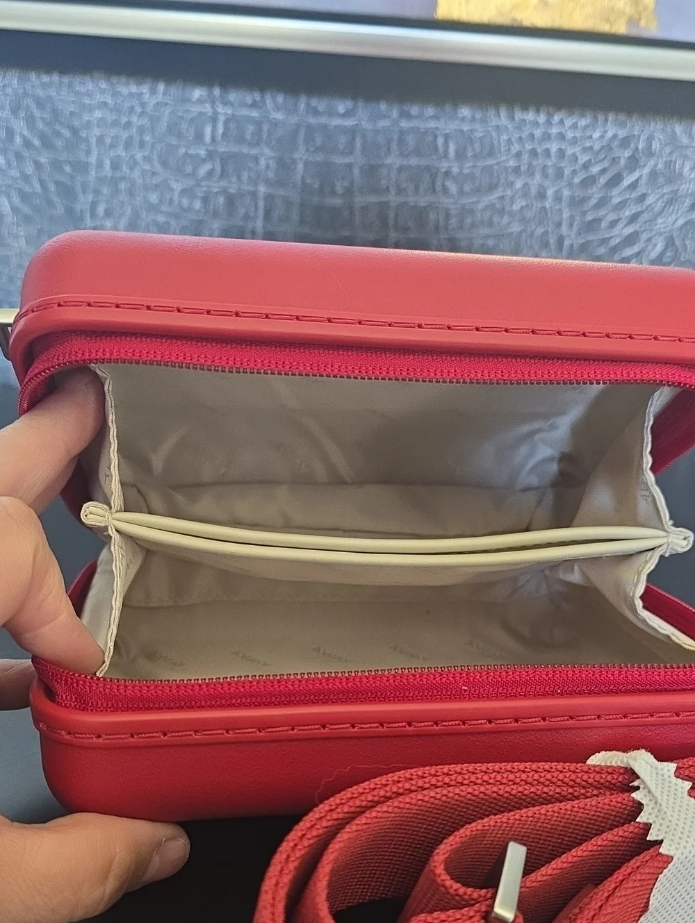 Away Small Hard-Shell Crossbody Case in  Tango Red with Matching Strap